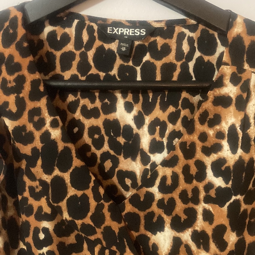 Express leopard sleeveless top. Black and brown cheetah print. Ruffle at sleeve. - Picture 2 of 3